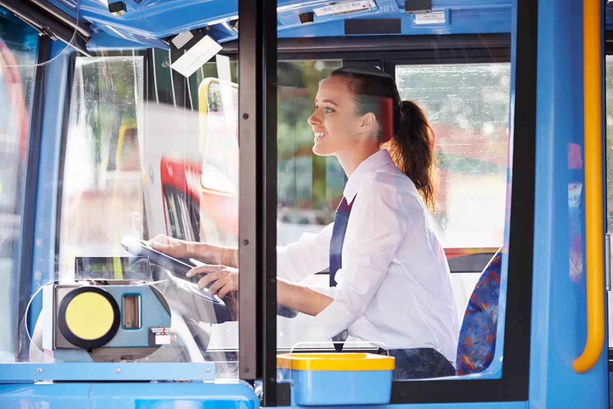 woung-woman-driving-public-bus